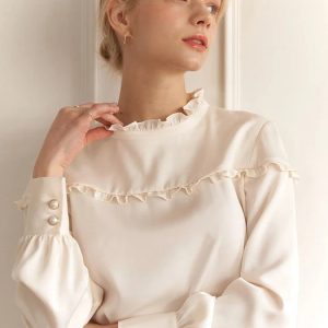 Ivory-colored ruffled satin shirt